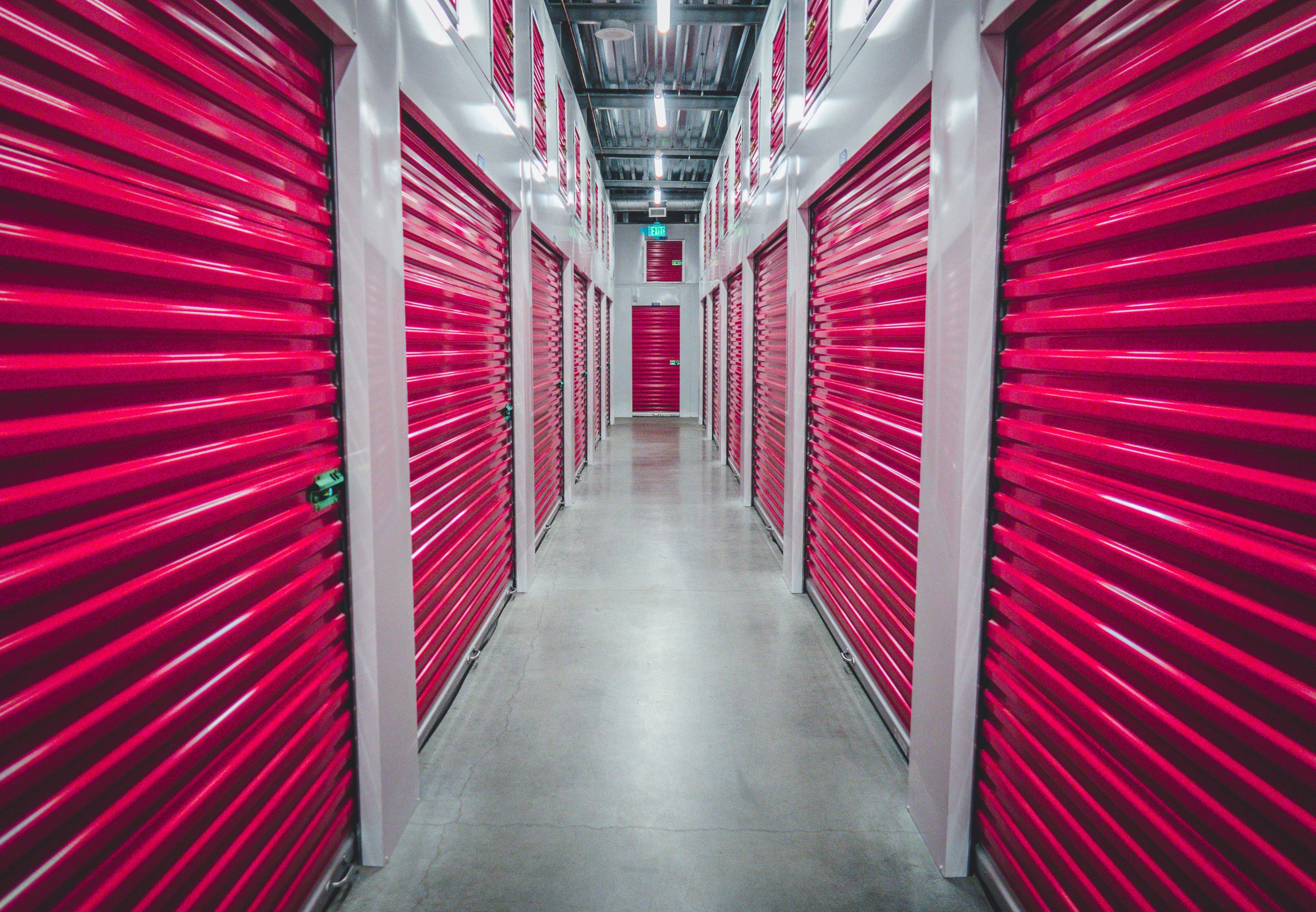 red roller doors for self storage in a corridor 