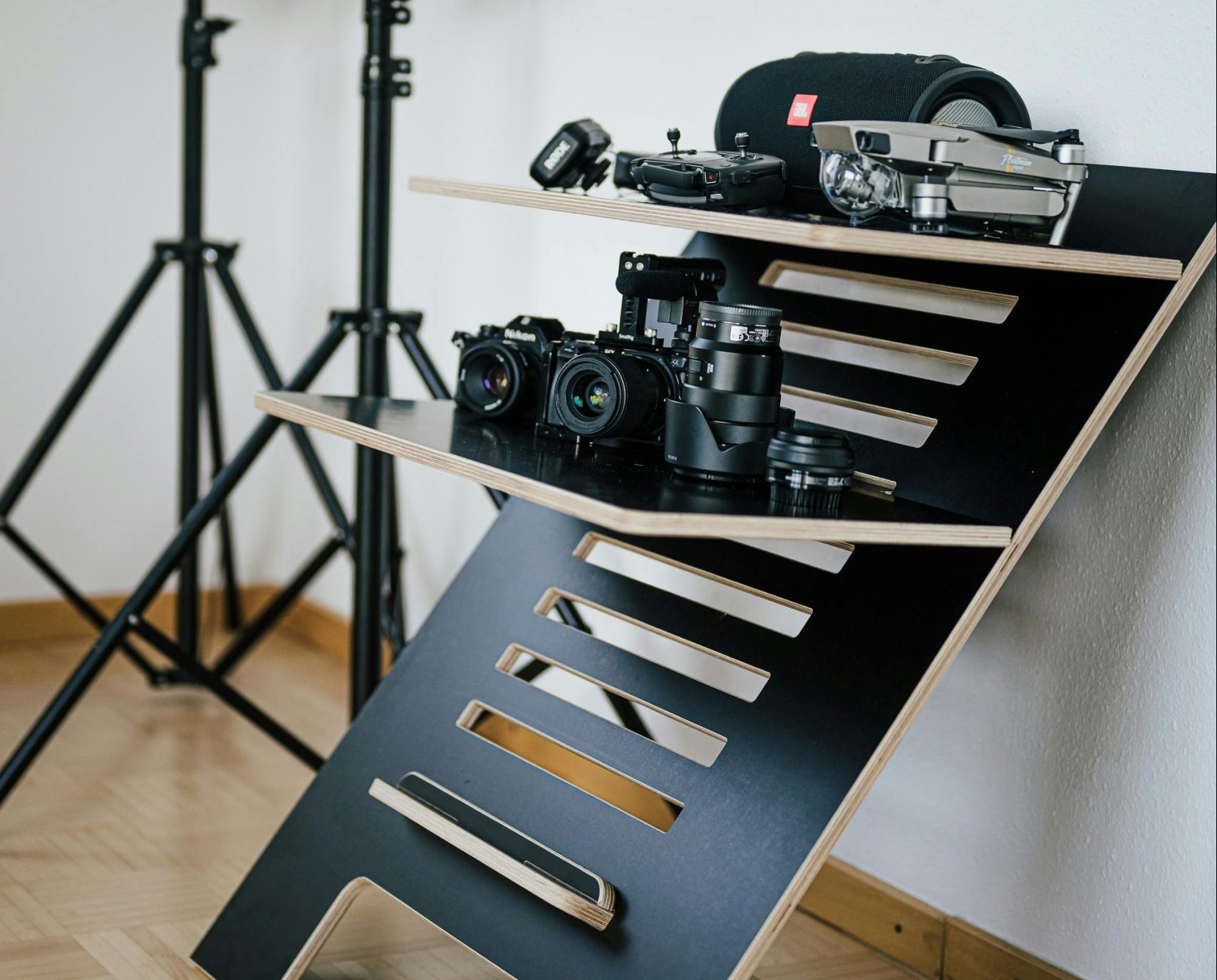 camera gear on a standing desk organiser